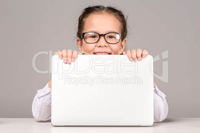 Schoolgirl holding laptop