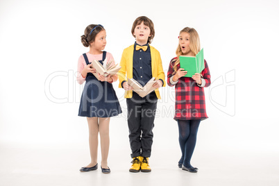 Schoolchildren standing with books