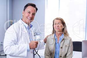 Portrait of smiling doctor and senior woman