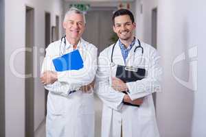 Portrait of smiling doctors standing together with clipboard