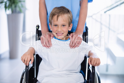 Portrait of smiling disable boy in wheelchair