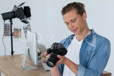 Photographer holding digital camera