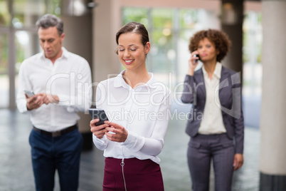 Business executive using mobile phone