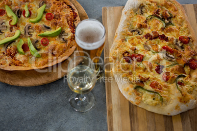 Italian pizza served with a beer glass