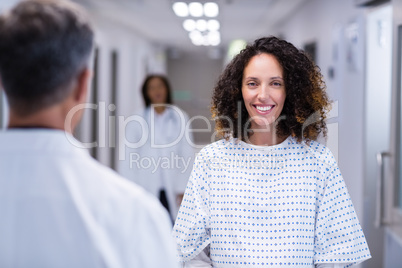 Portrait of pregnant woman standing in corridor Portrait of pregnant woman standing in corridor