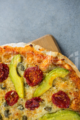 Close-up of pizza served on a pizza tray