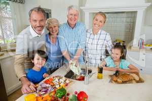 Happy family preparing food in kitchen