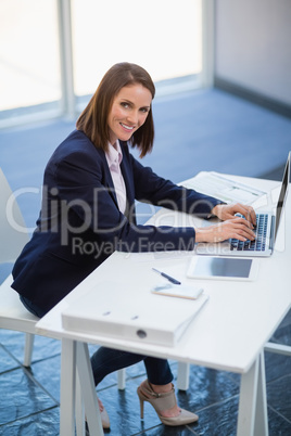 Businesswoman using laptop