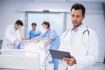 Doctor using digital tablet