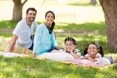 Happy family enjoying together in a park