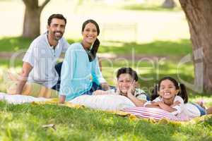 Happy family enjoying together in a park