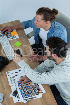 Photographers working together at desk