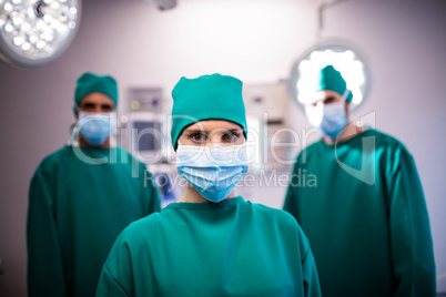 Portrait of medical team standing in a operating room
