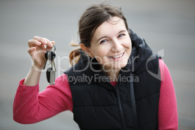 Woman holding car key