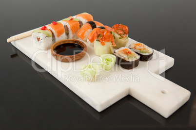 Assorted sushi set served with chopsticks and soy sauce