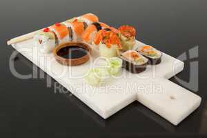 Assorted sushi set served with chopsticks and soy sauce