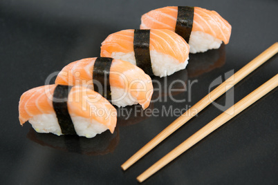 Sushi with chopsticks