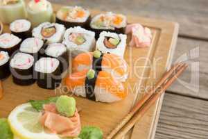 Set of assorted sushi served on wooden tray