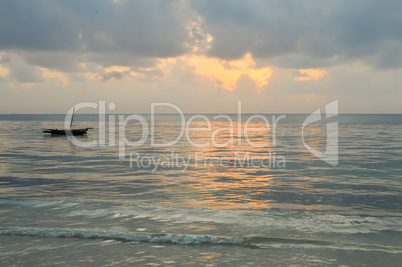 Dhow on the ocean at sunrise