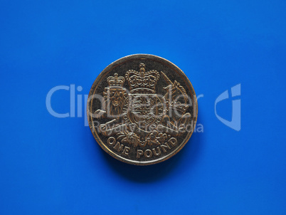 One Pound (GBP) coin, United Kingdom (UK) over blue