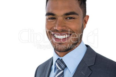 Smiling businessman standing against white background