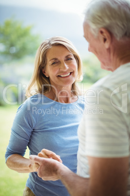 Senior couple holding each others hands