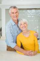 Happy senior couple in kitchen