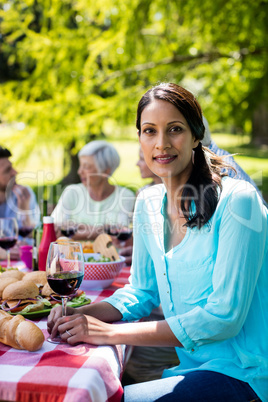 Portrait of beautiful woman having a glass of red wine