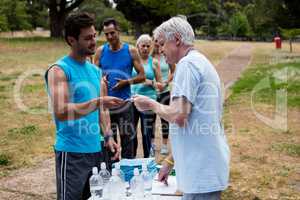 Volunteer registering athletes name for race