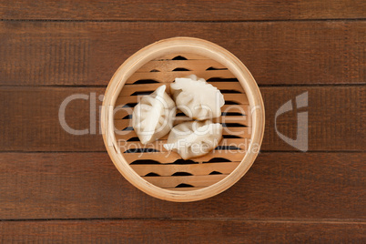 Dumplings in bamboo steamer