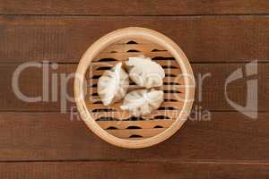 Dumplings in bamboo steamer