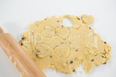 Close-up of rolling pin and cookie dough