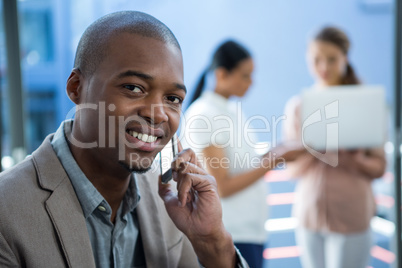 Business executive talking on mobile phone