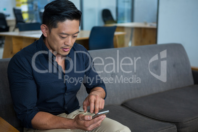 Business executive using mobile phone