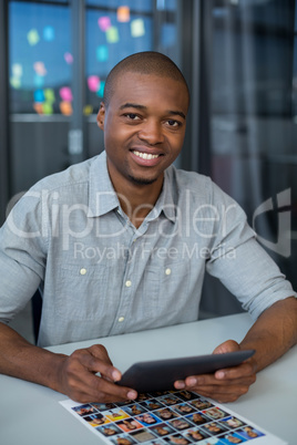 Male graphic designer using digital tablet