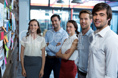 Business executives standing together in office