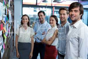 Business executives standing together in office