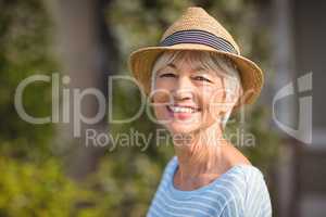 Happy senior woman in straw hat