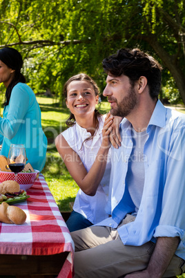 Couple interacting in park