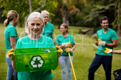 Recycling team member standing in park