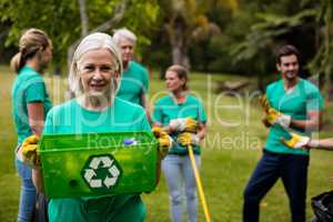 Recycling team member standing in park