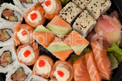 Set of assorted sushi kept in a black round box