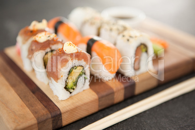 Assorted sushi set served on wooden board