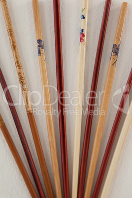 Pair of five chopsticks against white background