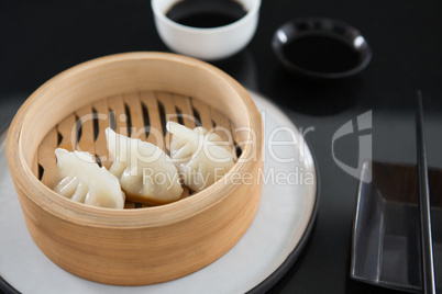 Steamed dumplings in bamboo steamer