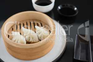 Steamed dumplings in bamboo steamer