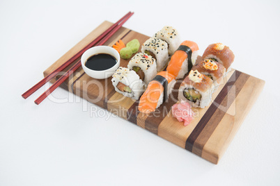 Set of assorted sushi served on wooden tray