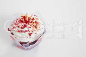 Close-up of delicious cake with red icing