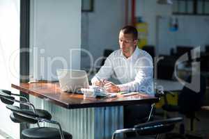 Attentive businessman working at desk