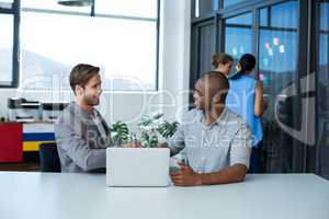 Businessman shaking hands with male executive